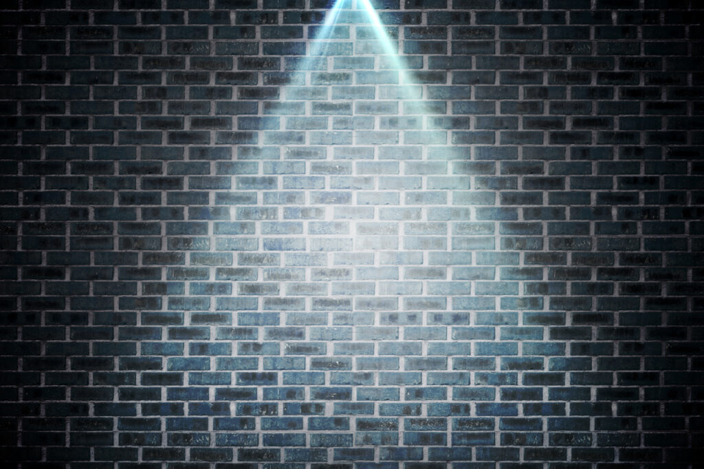 brick wall under spotlight